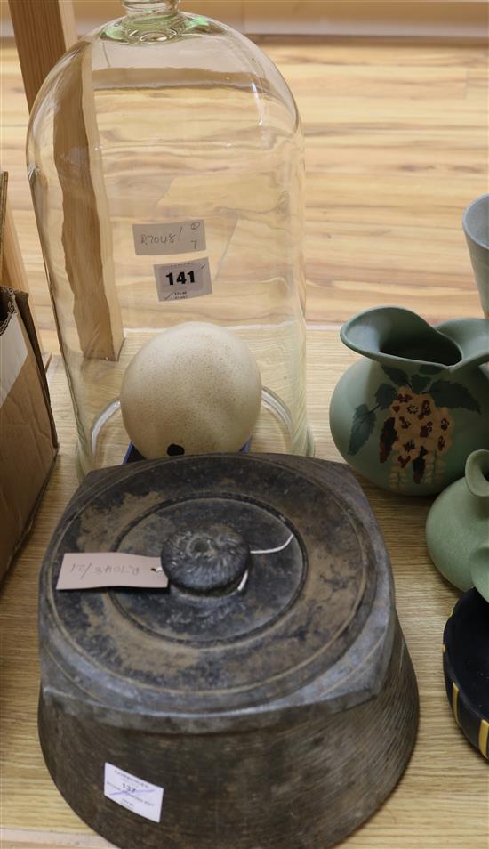 An ostrich egg and a glass medical vacuum dome and a stone cooking pot, dome height 46cm